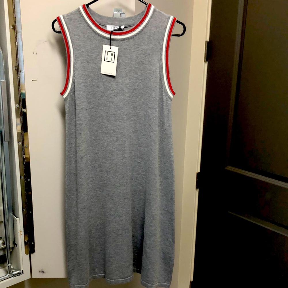Sleeveless gray dress with red and white varsity stripe.